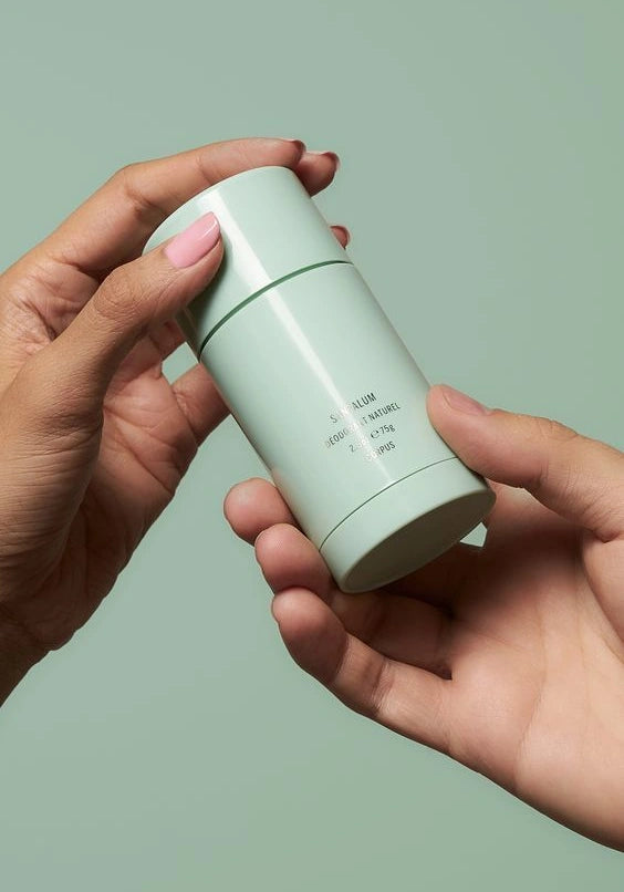 Corpus natural deodorant held in hand