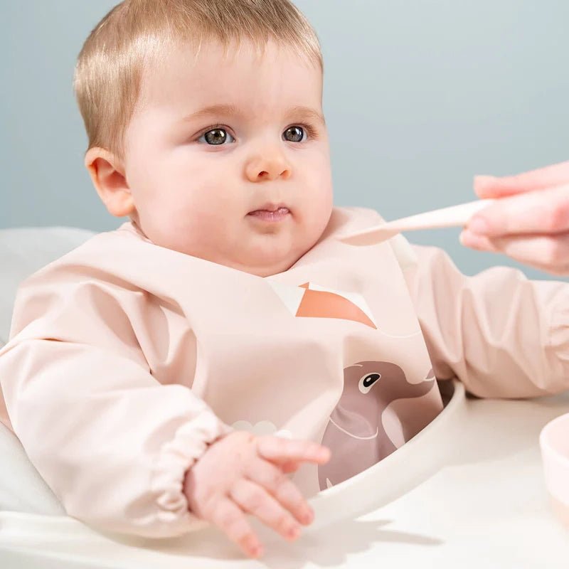 DONE BY DEER Playground Waterproof Long Sleeved Baby Bib with Elasticated Sleeves in Kuwait - Waha Lifestyle